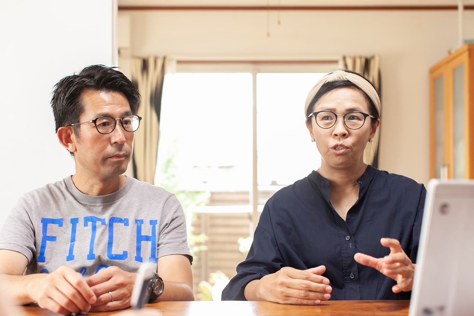 野口啓示さん（左）と、婦美子さん（ご夫妻の画像はいずれもシンポジウム前に撮影されたものです）